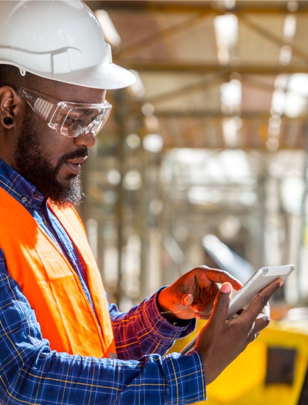 Acumen field professional using a tablet on site