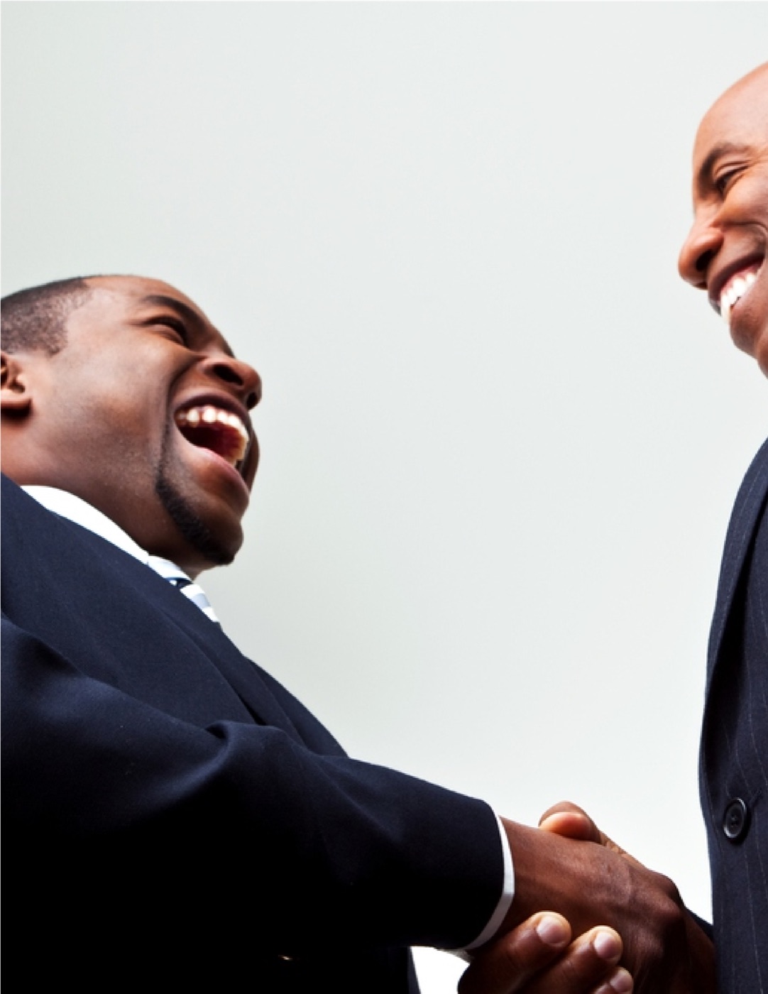 Two Acumen partners shaking hands